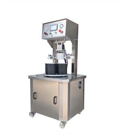 Machine de capsulage pour bouteilles en verre